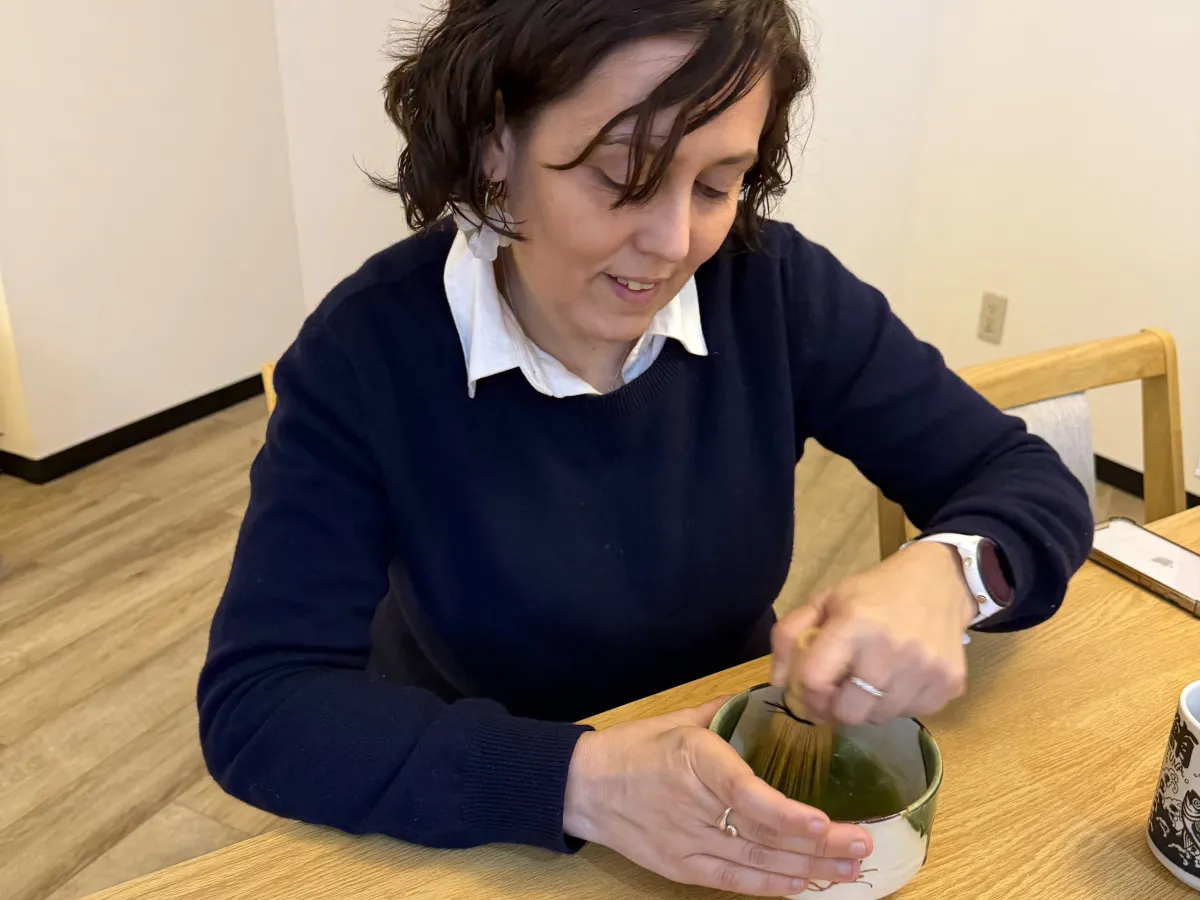 Whisking matcha tea