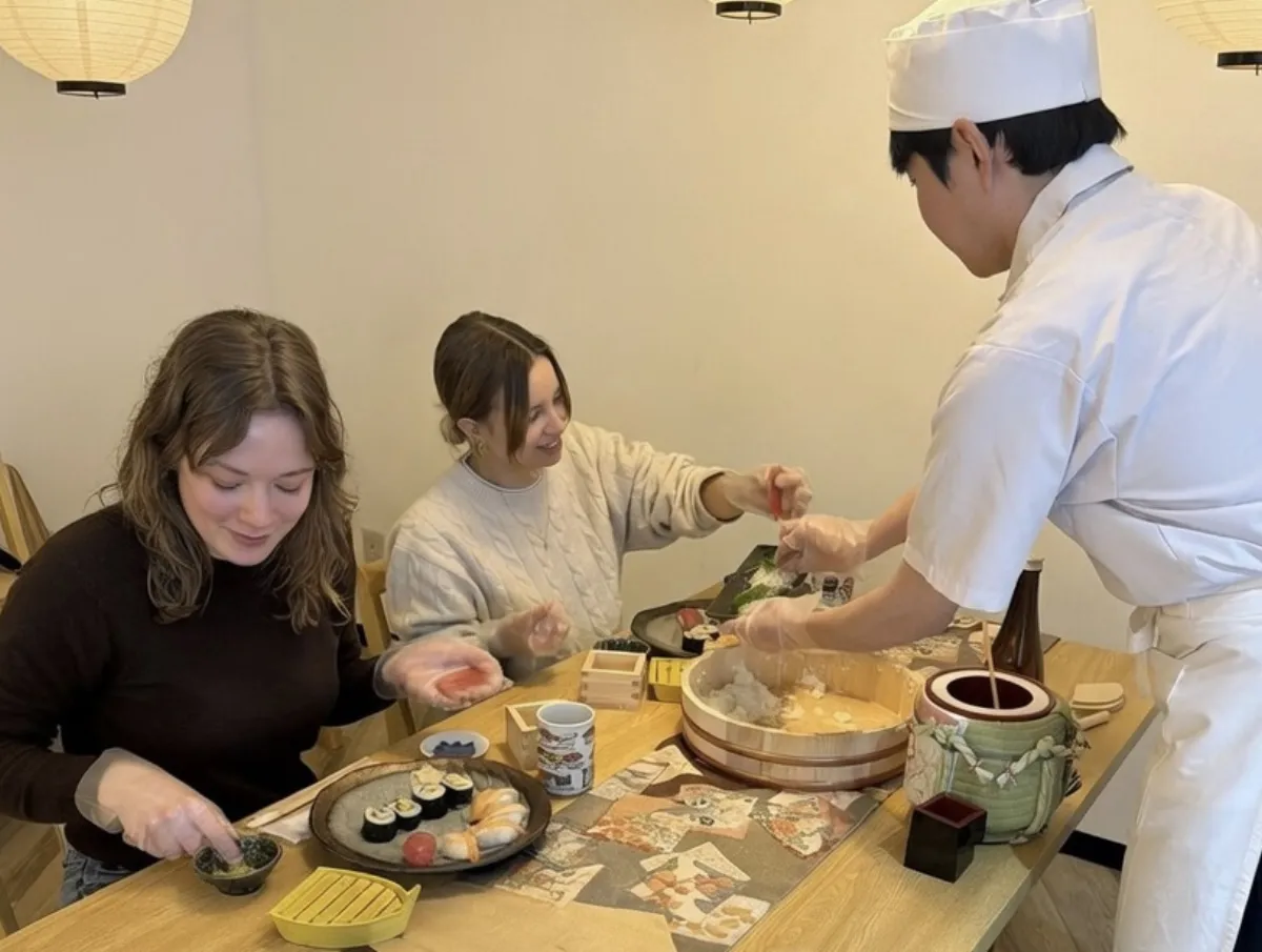 Sushi chef teaching guests step by step