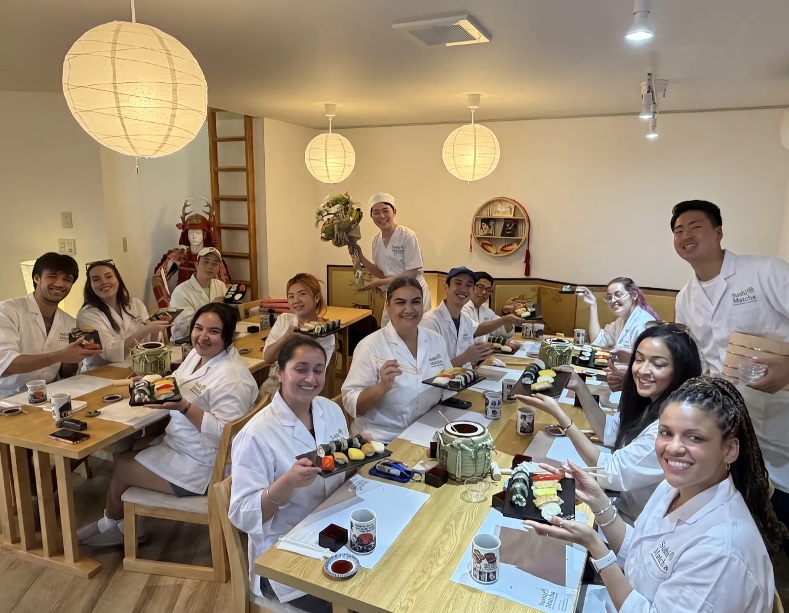 Large group enjoying a sushi making class in Asakusa, Tokyo